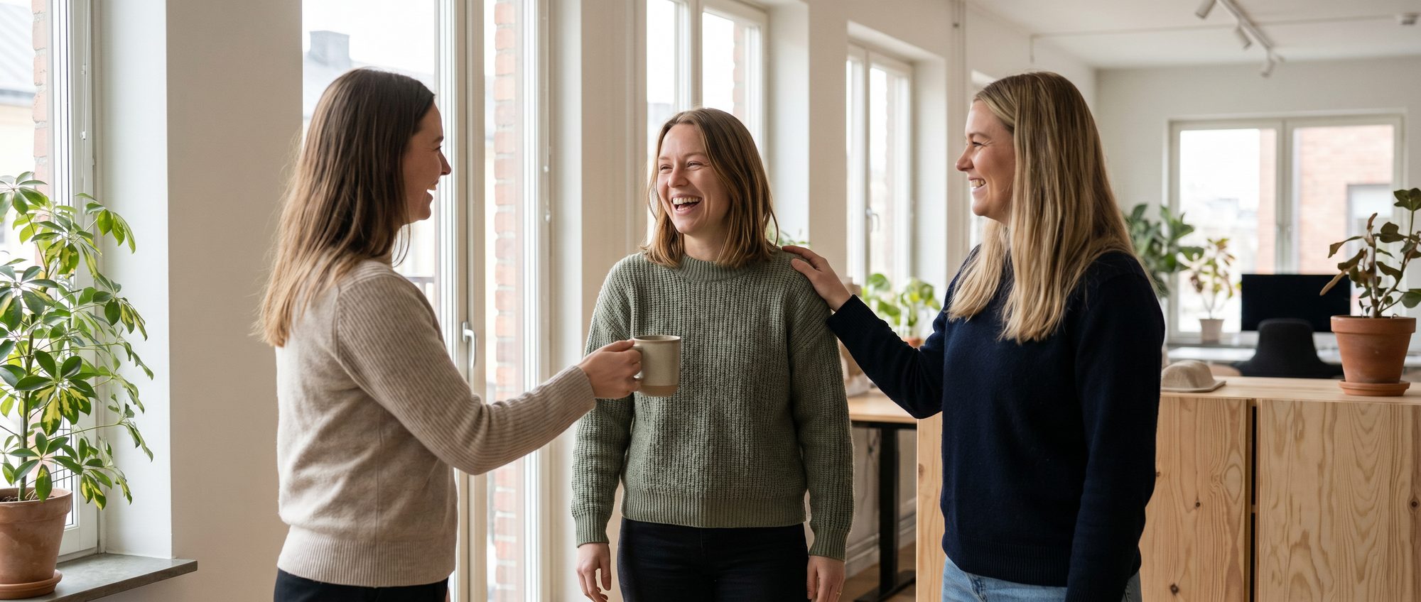 Sofia being welcomed by her new colleagues on her first day at the office